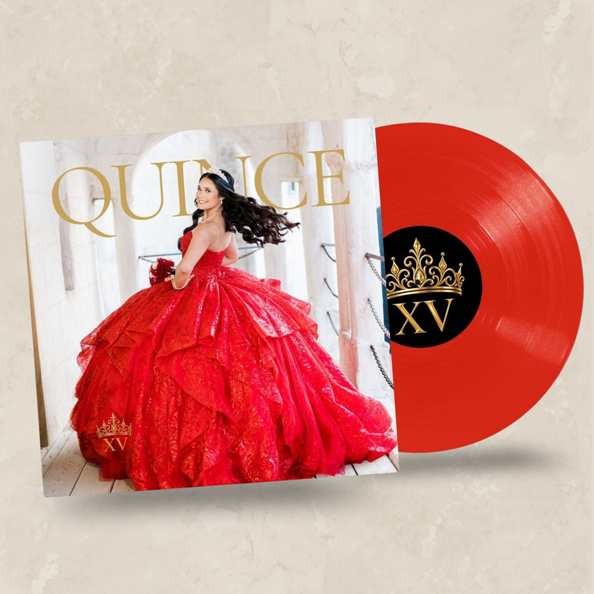 A red vinyl record partially covers a square album cover featuring a woman in a bright red quinceañera gown, with the word "QUINCE" in gold at the top and a black center label on the record reading "XV" with a gold crown.